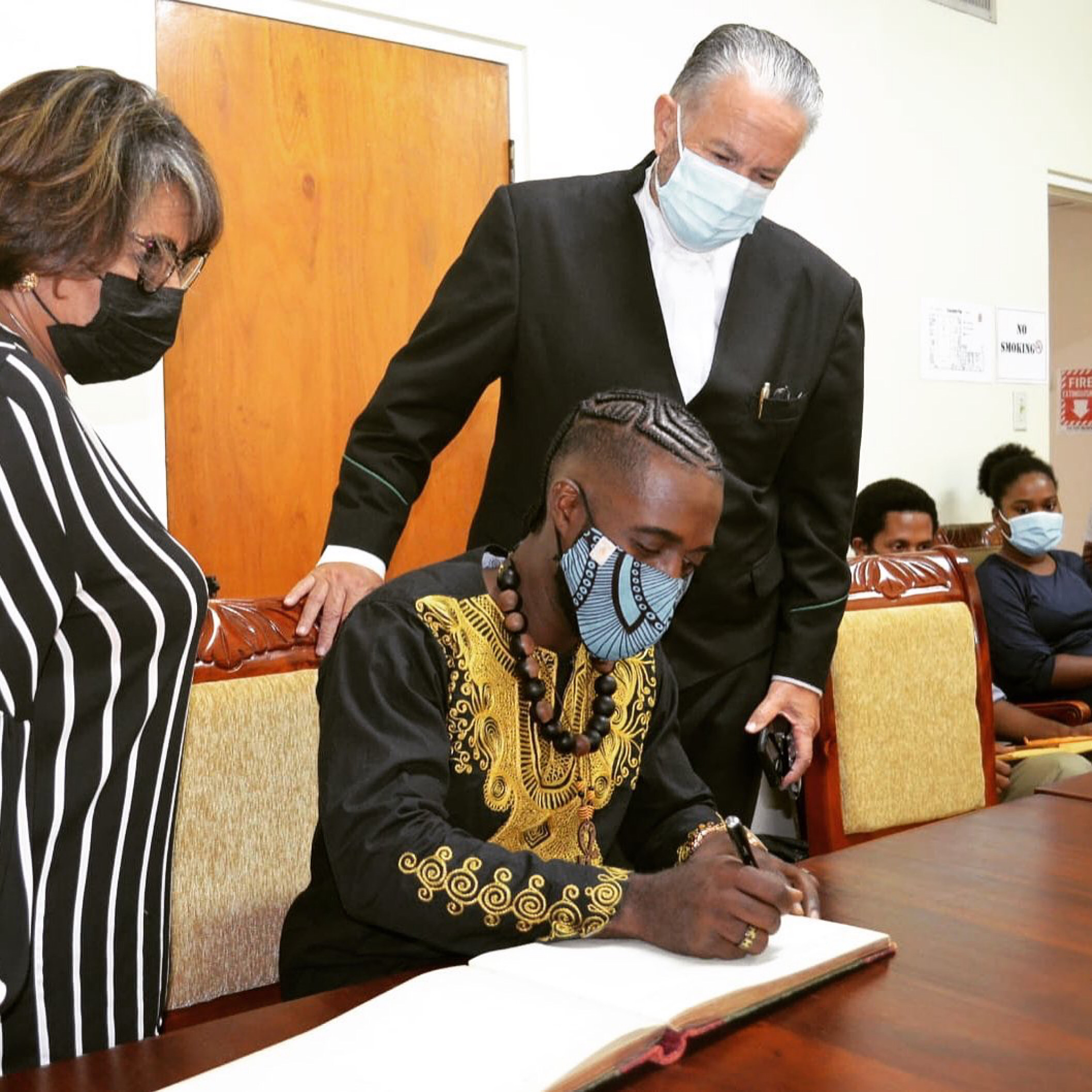 Chief Richard Currie signs Jamaica’s Parliament Official Visitor’s Log